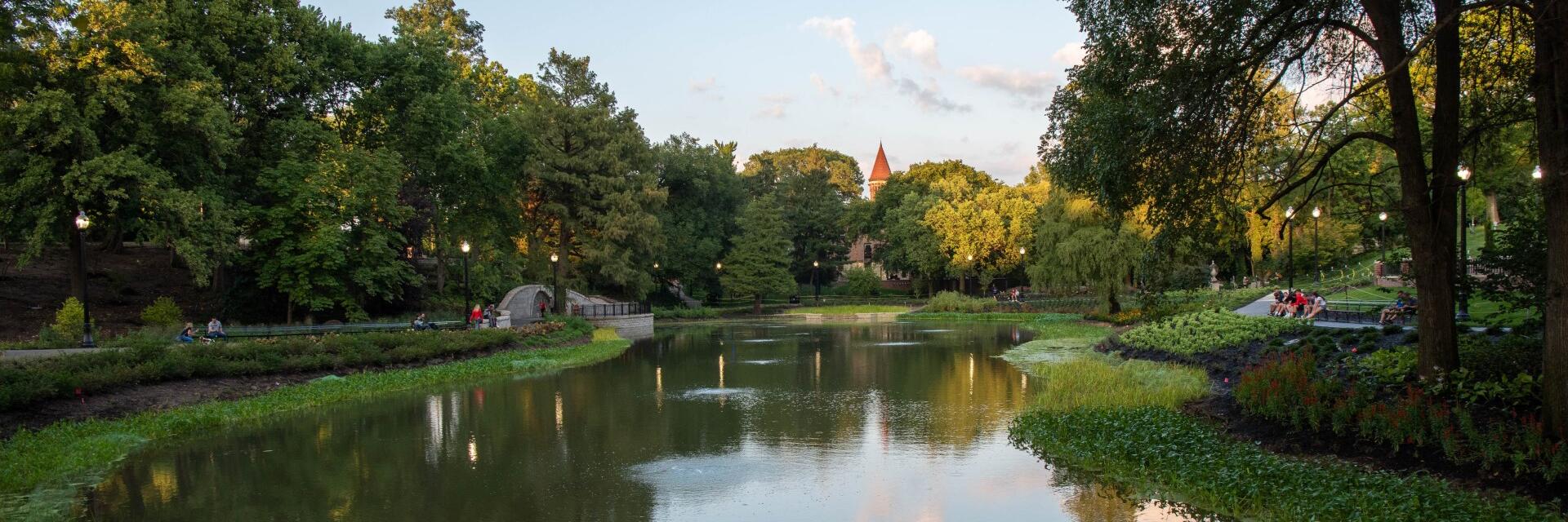 An image from the west end of Mirror Lake with the top of Orton Hall visible above the trees