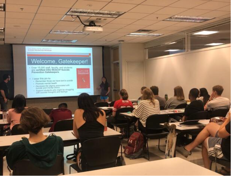 People watching a presentation at a training to become a REACH Suicide Prevention Gatekeeper.