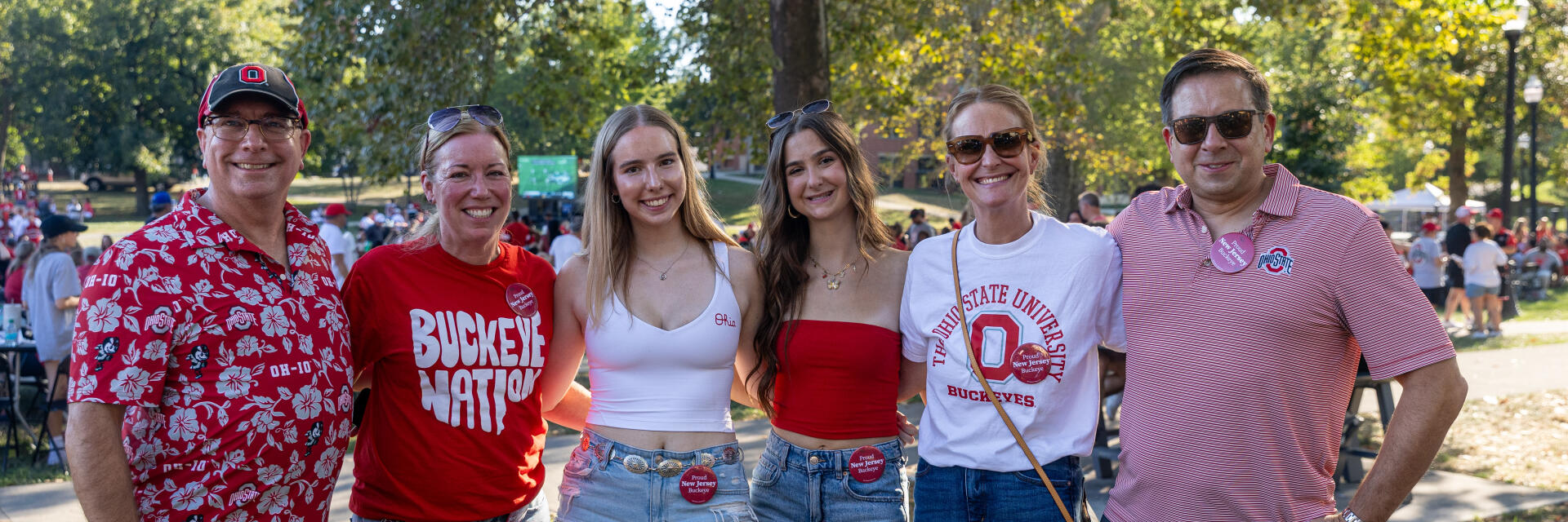 A family of six standing at Buckeye Family Tailgate 2025 wearing Ohio State gear