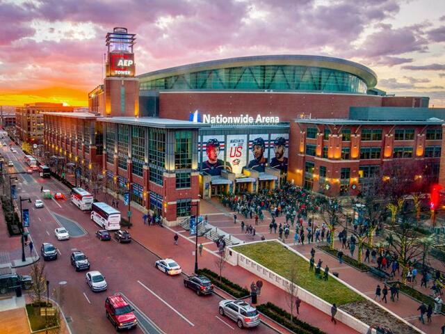 The east-side entrance of Nationwide Arena with event attendees waiting in line to enter