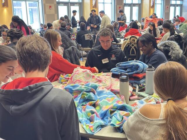 Students and community members make blankets for MLK Day of Service in the Ohio Union