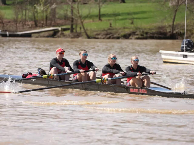 Four women rowing from the Ohio State women's rowing team