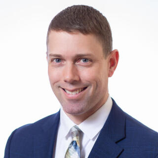 Matt Couch wearing a dark blue suit