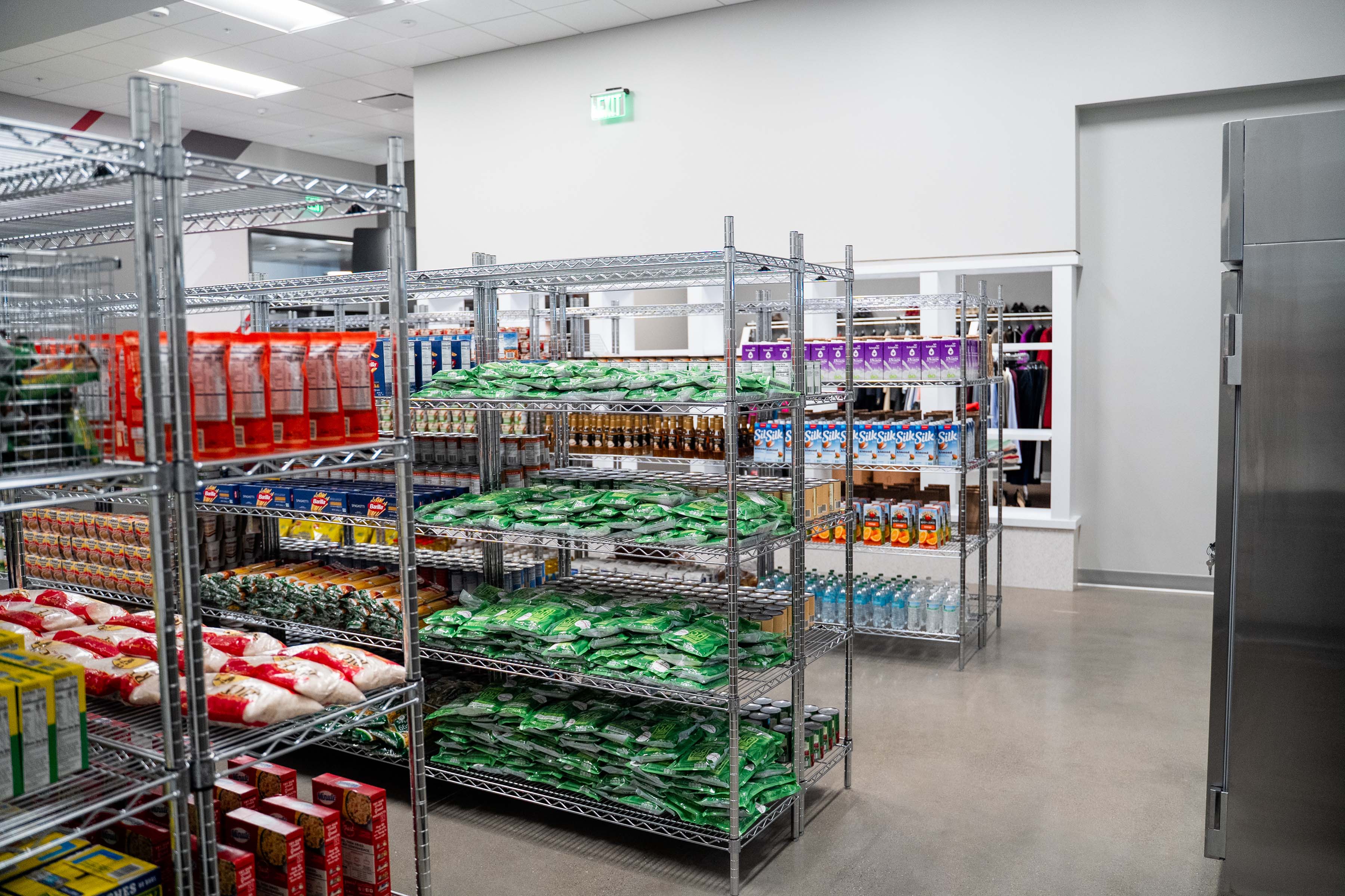 Inside the Monda Student Resource Center, facing the food pantry with food items on shelves