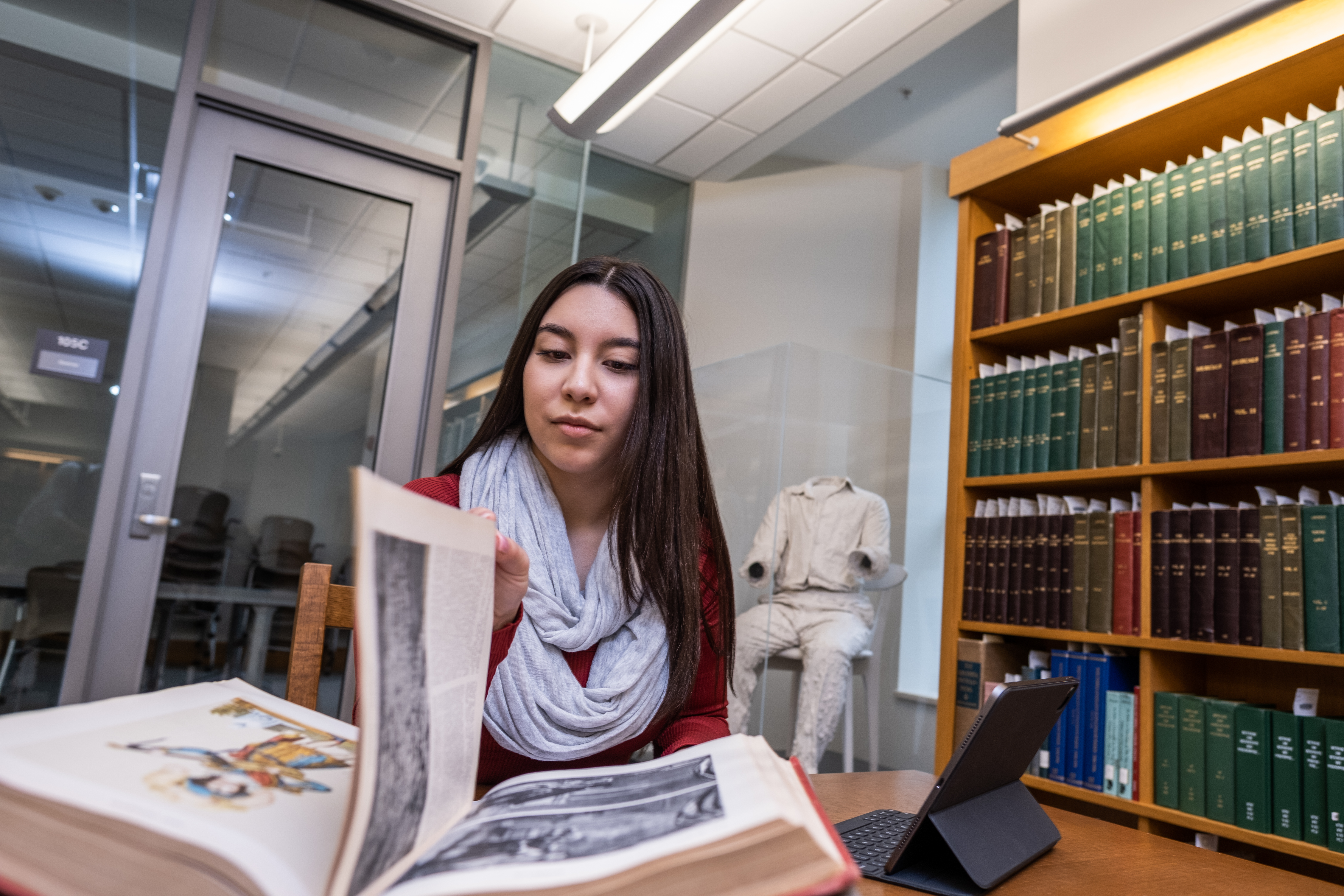 Student interacting with materials in Special Collections Reading Room